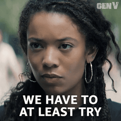 A Close Up Of A Woman With The Words We Have To At Least Try GIF