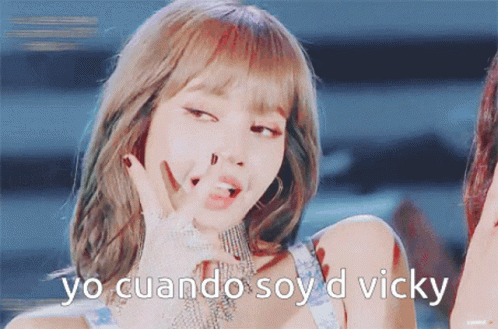 A Close Up Of A Woman With The Words Yo Cuando Soy D Vicky On The Bottom GIF