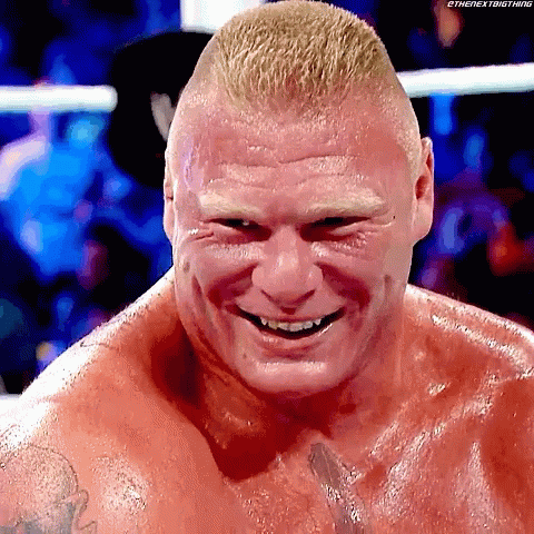A Close Up Of A Wrestler 'S Face With A Smile On It . GIF