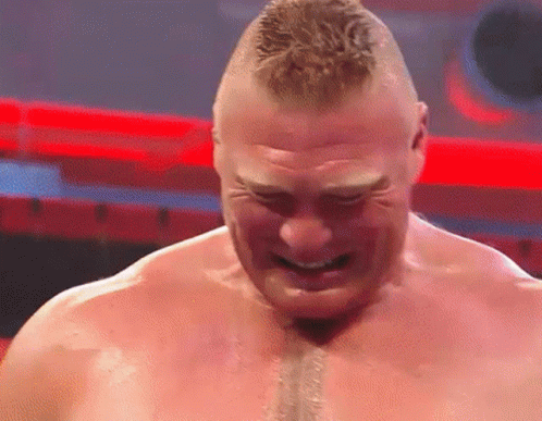 A Close Up Of A Wrestler 'S Face With His Mouth Open . GIF
