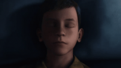 A Close Up Of A Young Boy 'S Face Against A Dark Background GIF