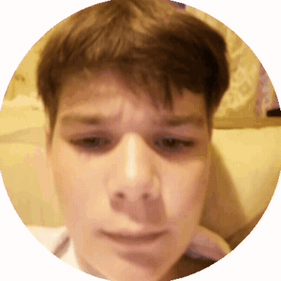 A Close Up Of A Young Boy 'S Face In A Circle GIF
