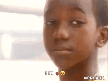 A Close Up Of A Young Boy 'S Face With A Smiley Face On His Neck . GIF