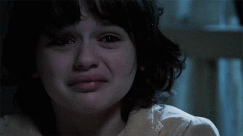 A Close Up Of A Young Girl 'S Face With Tears Running Down Her Face GIF