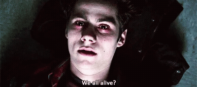 A Close Up Of A Young Man Laying On The Ground With Blood On His Face And A Question . GIF