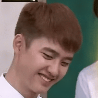 A Close Up Of A Young Man Making A Funny Face While Wearing A White Shirt . GIF