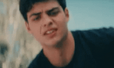 A Close Up Of A Young Man 'S Face Making A Funny Face . GIF