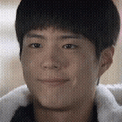 A Close Up Of A Young Man 'S Face Wearing A Fur Jacket GIF