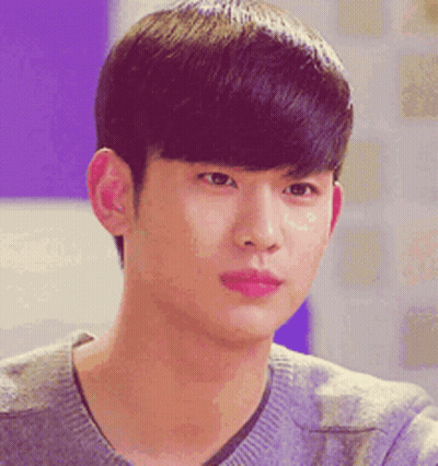 A Close Up Of A Young Man 'S Face Wearing A Gray Sweater GIF