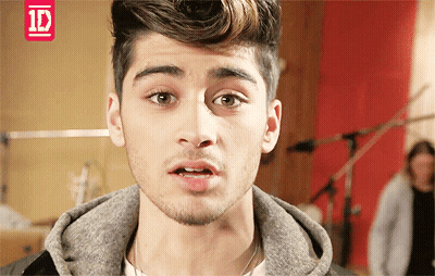 A Close Up Of A Young Man 'S Face With A 1D Logo In The Corner GIF