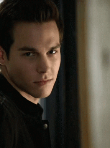 A Close Up Of A Young Man 'S Face With A Black Jacket On GIF