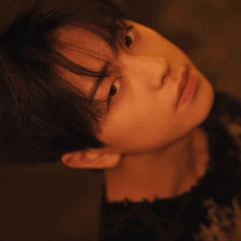 A Close Up Of A Young Man 'S Face With A Blurred Background GIF