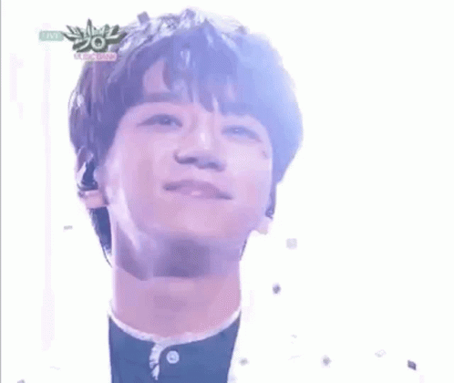 A Close Up Of A Young Man 'S Face With A Microphone In His Ear . GIF