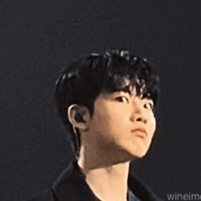 A Close Up Of A Young Man 'S Face With A Serious Expression . GIF