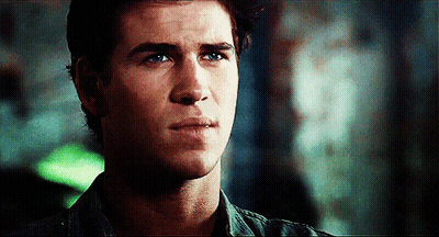 A Close Up Of A Young Man 'S Face With A Serious Look On His Face GIF