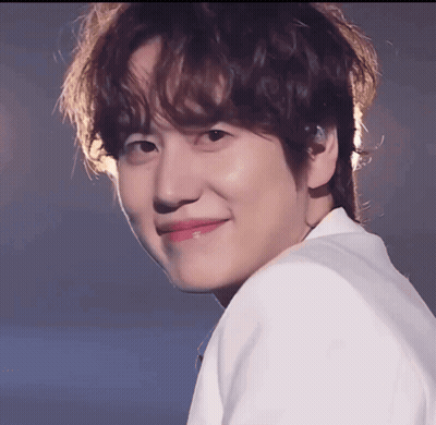 A Close Up Of A Young Man 'S Face With A Smile On His Face GIF