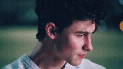 A Close Up Of A Young Man 'S Face With A Sweater On GIF