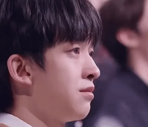 A Close Up Of A Young Man 'S Face With A Tear Running Down His Cheek . GIF