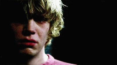 A Close Up Of A Young Man 'S Face With A Tear Running Down His Cheek . GIF
