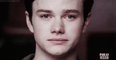A Close Up Of A Young Man 'S Face With A Tear Running Down His Face . GIF