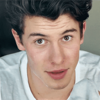 A Close Up Of A Young Man 'S Face With His Eyes Closed GIF