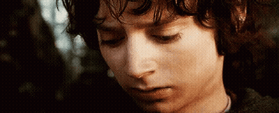 A Close Up Of A Young Man 'S Face With His Eyes Closed And A Tear Running Down His Cheek . GIF
