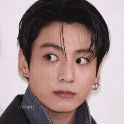 A Close Up Of A Young Man 'S Face With His Eyes Closed And His Mouth Open . GIF