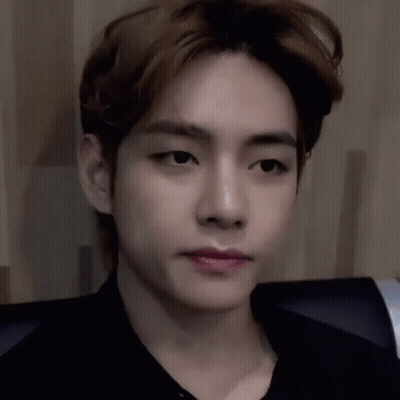 A Close Up Of A Young Man 'S Face With His Eyes Closed And His Mouth Open . GIF