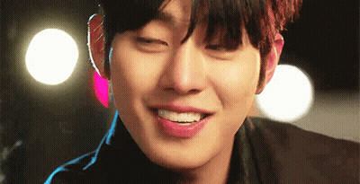 A Close Up Of A Young Man 'S Face With His Eyes Closed And His Mouth Open . GIF
