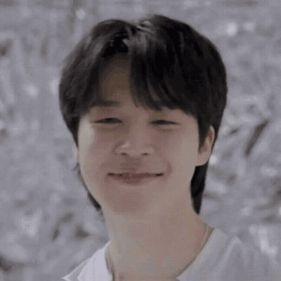 A Close Up Of A Young Man 'S Face With His Eyes Closed . GIF