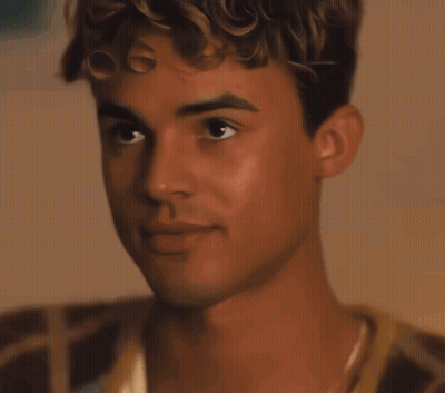 A Close Up Of A Young Man 'S Face With His Eyes Closed GIF