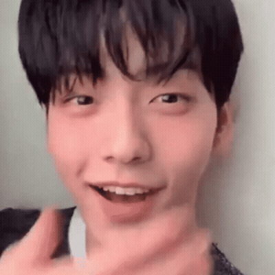 A Close Up Of A Young Man 'S Face With His Mouth Open And A Cigarette In His Mouth . GIF