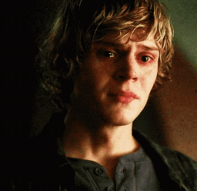 A Close Up Of A Young Man 'S Face With Tears Running Down His Cheeks GIF