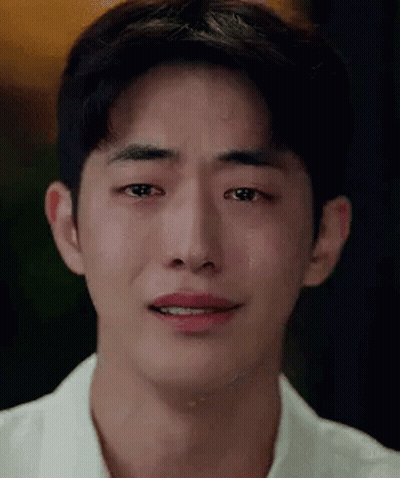 A Close Up Of A Young Man 'S Face With Tears Running Down His Face . GIF