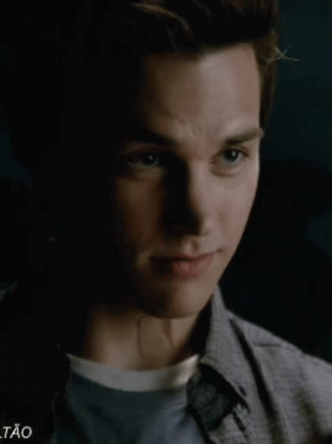 A Close Up Of A Young Man 'S Face With The Word Tao Visible GIF