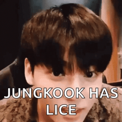 A Close Up Of A Young Man 'S Face With The Words Jungkook Has Lice Written On It . GIF