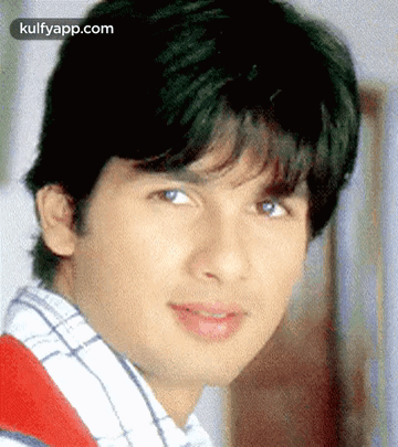 A Close Up Of A Young Man 'S Face With The Words Kulfyapp.com At The Top GIF