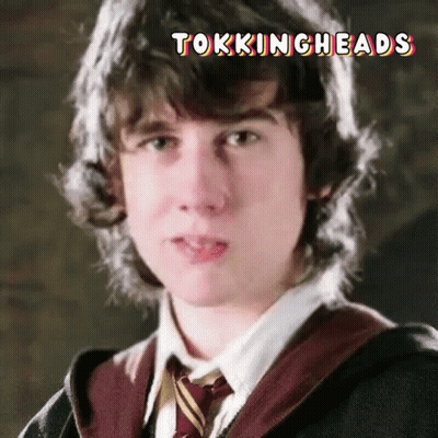 A Close Up Of A Young Man 'S Face With The Words Tockingheads Written Above Him GIF
