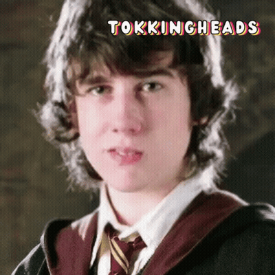A Close Up Of A Young Man 'S Face With The Words Tockingheads Written Above Him GIF