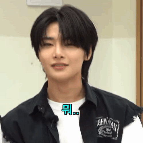 A Close Up Of A Young Man Wearing A Black Shirt And A White Shirt . GIF