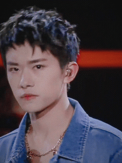 A Close Up Of A Young Man Wearing A Denim Jacket GIF