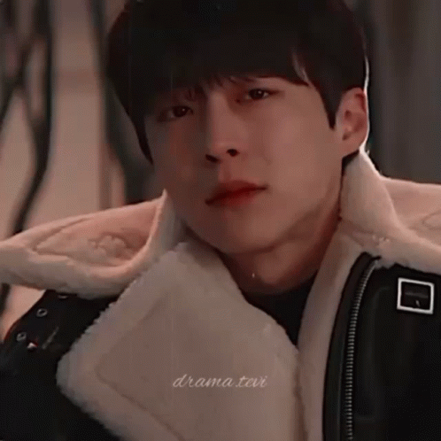 A Close Up Of A Young Man Wearing A Fur Coat GIF