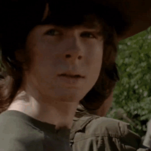 A Close Up Of A Young Man Wearing A Hat And A Black Shirt GIF