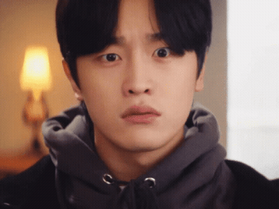 A Close Up Of A Young Man Wearing A Hoodie GIF