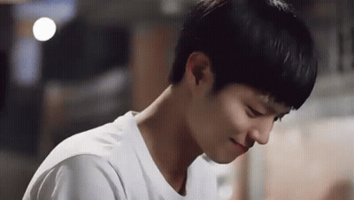 A Close Up Of A Young Man Wearing A White T-Shirt . GIF