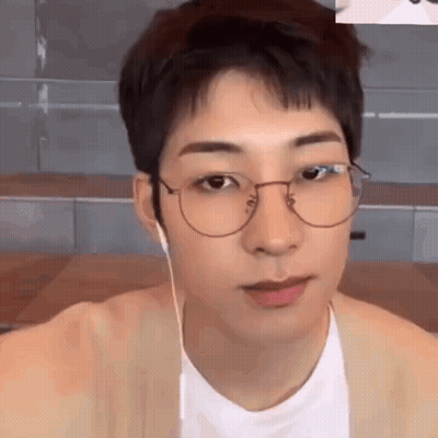 A Close Up Of A Young Man Wearing Glasses And Headphones . GIF