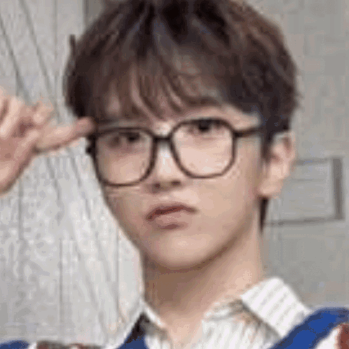 A Close Up Of A Young Man Wearing Glasses And Making A Funny Face . GIF