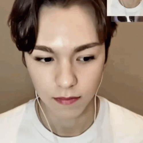 A Close Up Of A Young Man Wearing Headphones . GIF