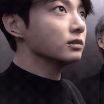 A Close Up Of A Young Man With A Piercing In His Lip . GIF