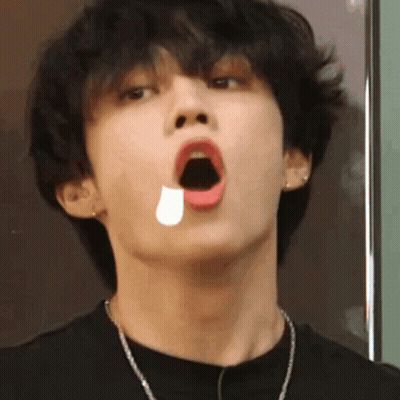 A Close Up Of A Young Man With His Mouth Open And A Tear Coming Out Of His Mouth . GIF